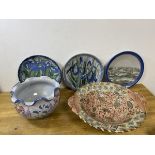 Three Scottish stoneware decorative wall plates, two with iris decoration and the other with