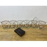 A set of six 1970's cocktail glasses inscribed Name Your Poison and each glass showing a different