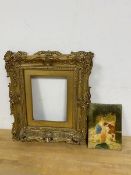 A composition moulded gilt frame, aperture measures 19cm x 14cm and an oil on panel depicting two