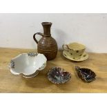 A collection of Studio Pottery including a cup and saucer, saucer stamped J B S with fleur de lys,