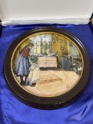 A Royal Copenhagen wall plaque The Kitchen Number 4641/9500 , measures 20cm diameter, in original