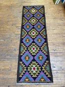 A Maimana Quillam runner with a repeating geometric diamond field, measures 195cm x 62cm