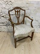 A 19thc Scottish shieldback armchair, the pierced splat over a later upholstered floral seat, on
