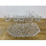 A set of four whisky glasses with etched thistle decoration, each measures 7cm high, along with a