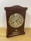 A 1920's mantel clock of architectural form, bears plaque inscribed Presented to I J Arrigh on the