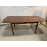 A Vanson Mid Century teak dining table with single leaf on plain freize and straight square tapering
