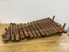 A modern marimba, measures 20cm x 90cm x 44cm