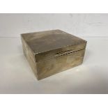 A 1956 Birmingham silver cigarette box, measures 4cm x 9cm x 9cm