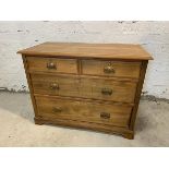 An Edwardian ash chest of drawers, the rectangular moulded top over two short drawers and two