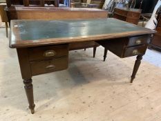 A Victorian oak and stained pine kneehole desk, the top with insert skiver over four drawers