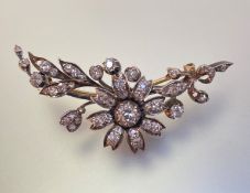A diamond floral-spray brooch, c. 1900, set throughout with graduated round brilliant-cut stones