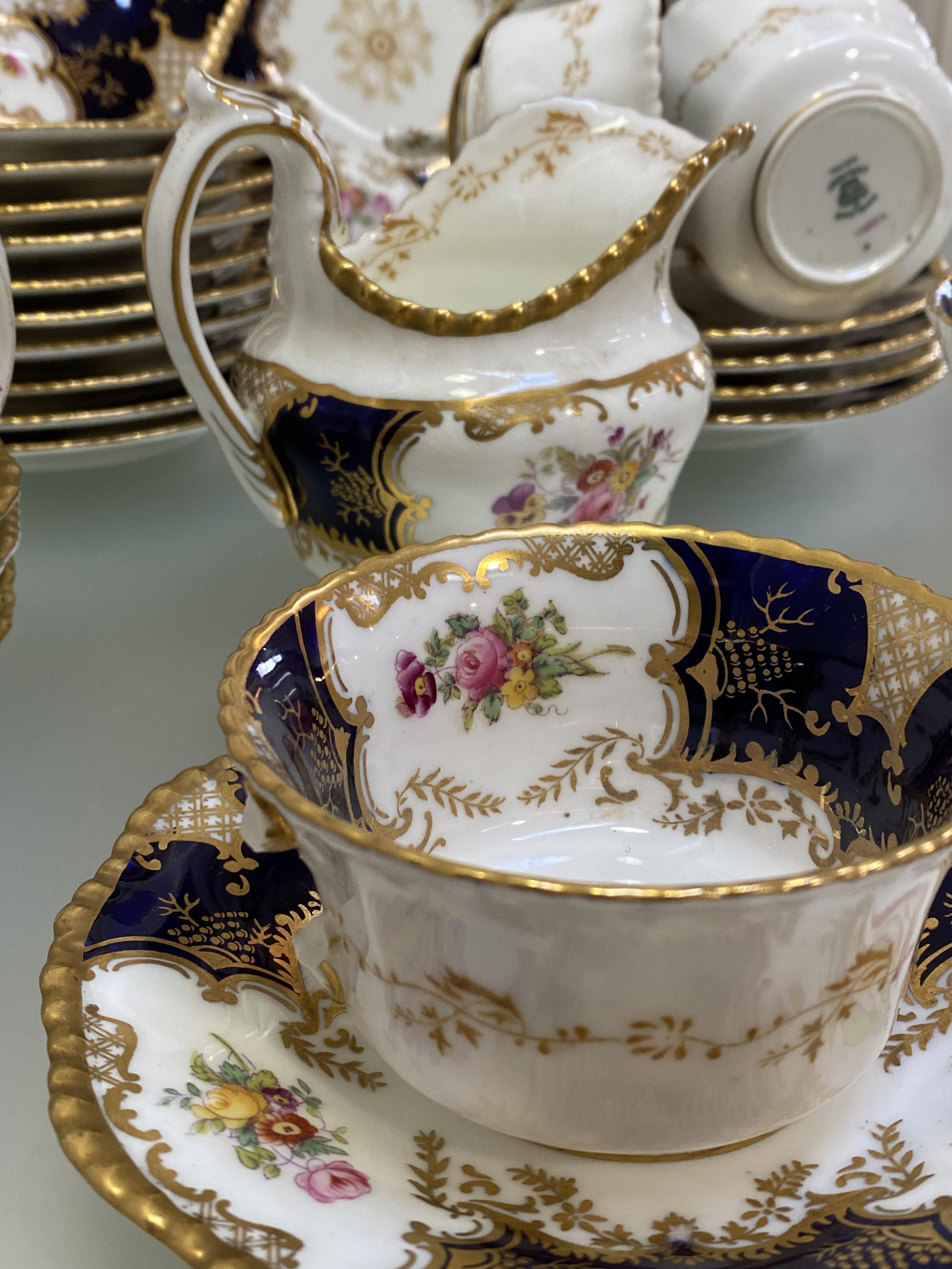 A Coalport Batwing 2665 pattern tea service, c. 1900, comprising: eleven cups, twelve saucers, - Image 2 of 7