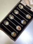A cased set of eight enamelled silver coffee spoons, Henry Clifford Davis, Birmingham 1951, the bowl
