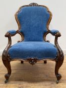 A Victorian walnut framed open armchair, the crest rail carved with 'C' scrolls and acanthus leaf
