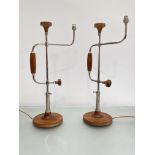 David Linley: a pair of adjustable "Brace" desk lamps, each with maker's label to base. Height 65cm