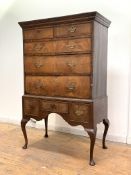 An 18th century and later walnut chest on stand, the projecting cornice over two short and three