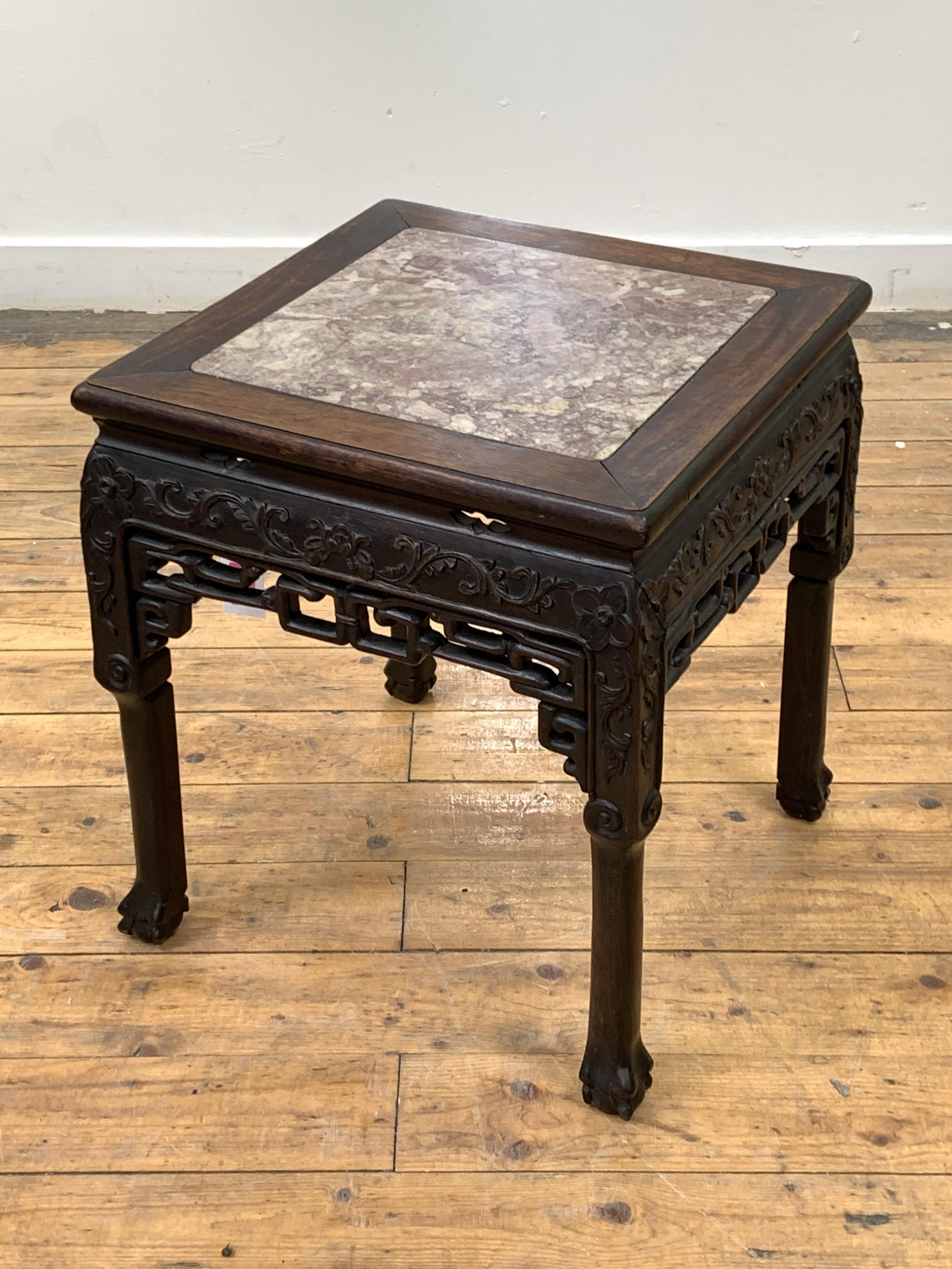 A late 19th / early 20th century Chinese rosewood jardiniere stand of square form, the top inset