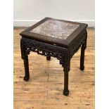 A late 19th / early 20th century Chinese rosewood jardiniere stand of square form, the top inset