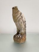 An Italian carved alabaster model of a hawk or falcon, early 20th century, modelled perched on a