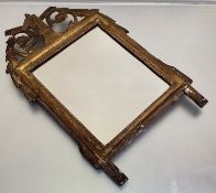 An early 19th century small giltwood wall mirror, probably French, the rectangular plate within a