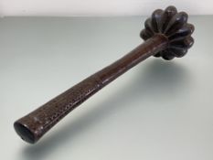 Fiji: a throwing club, (Ula), the cylindrical shaft with geometric chip-carved handle, the lobed