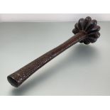 Fiji: a throwing club, (Ula), the cylindrical shaft with geometric chip-carved handle, the lobed