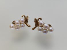 A pair of 9ct gold cultured pearl earrings, each modelled with five uniform pearls as grapes on a