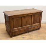 A late 18th century stained pine mule chest, the rectangular moulded hinged top lifting to reveal