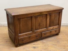 A late 18th century stained pine mule chest, the rectangular moulded hinged top lifting to reveal