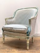 A French bergère in the Louis XV taste, the cream and blue painted fluted show frame enclosing back,