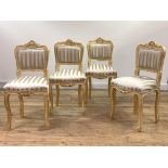 A set of four giltwood side chairs in the Louis XV taste, the shell carved crest rail over back
