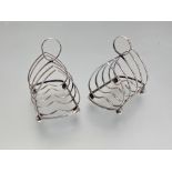 A pair of George V silver toast racks, J. B. Chatterley & Sons, Birmingham 1928, each of four