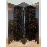 An early to mid 20th century Chinese lacquered four fold screen, painted with birds and foliate,