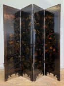 An early to mid 20th century Chinese lacquered four fold screen, painted with birds and foliate,