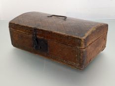 A stamped leather dome-top box, 18th century, of rectangular form, the hinged cover with swing