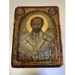 Russian School, an icon depicting a Saint, his robe decorated with crosses, against a gold ground,