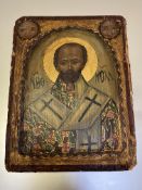 Russian School, an icon depicting a Saint, his robe decorated with crosses, against a gold ground,