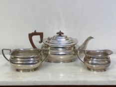 A silver three piece tea service, Sheffield 1961, in the Regency taste, each piece of bellied