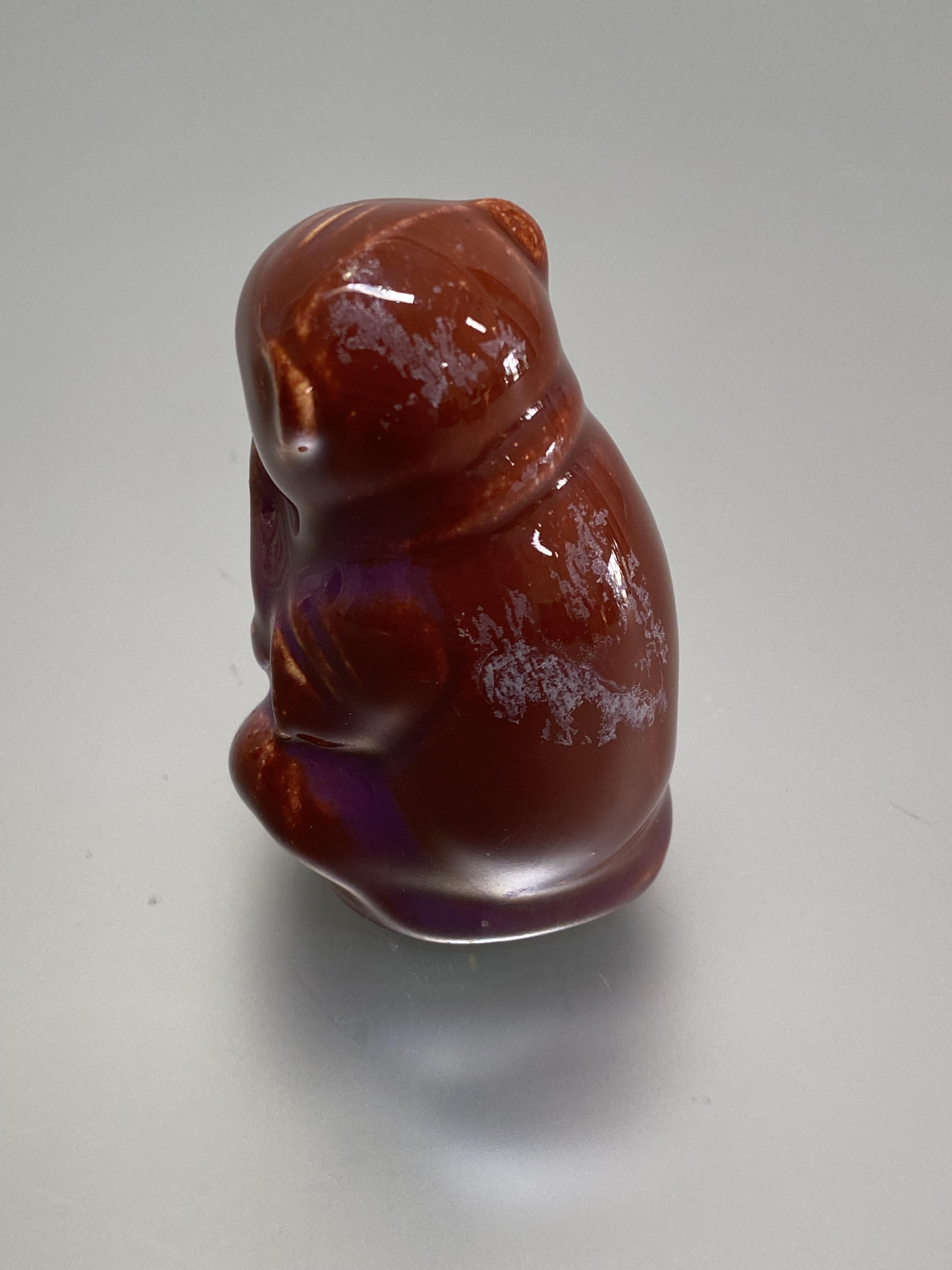 A Burmantofts Faience model of a seated monkey, in an oxblood glaze, incised no. 1996 and factory - Image 2 of 3