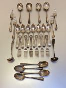 A mixed group of 19th century silver flatware comprising: seven Fiddle pattern dessert spoons,