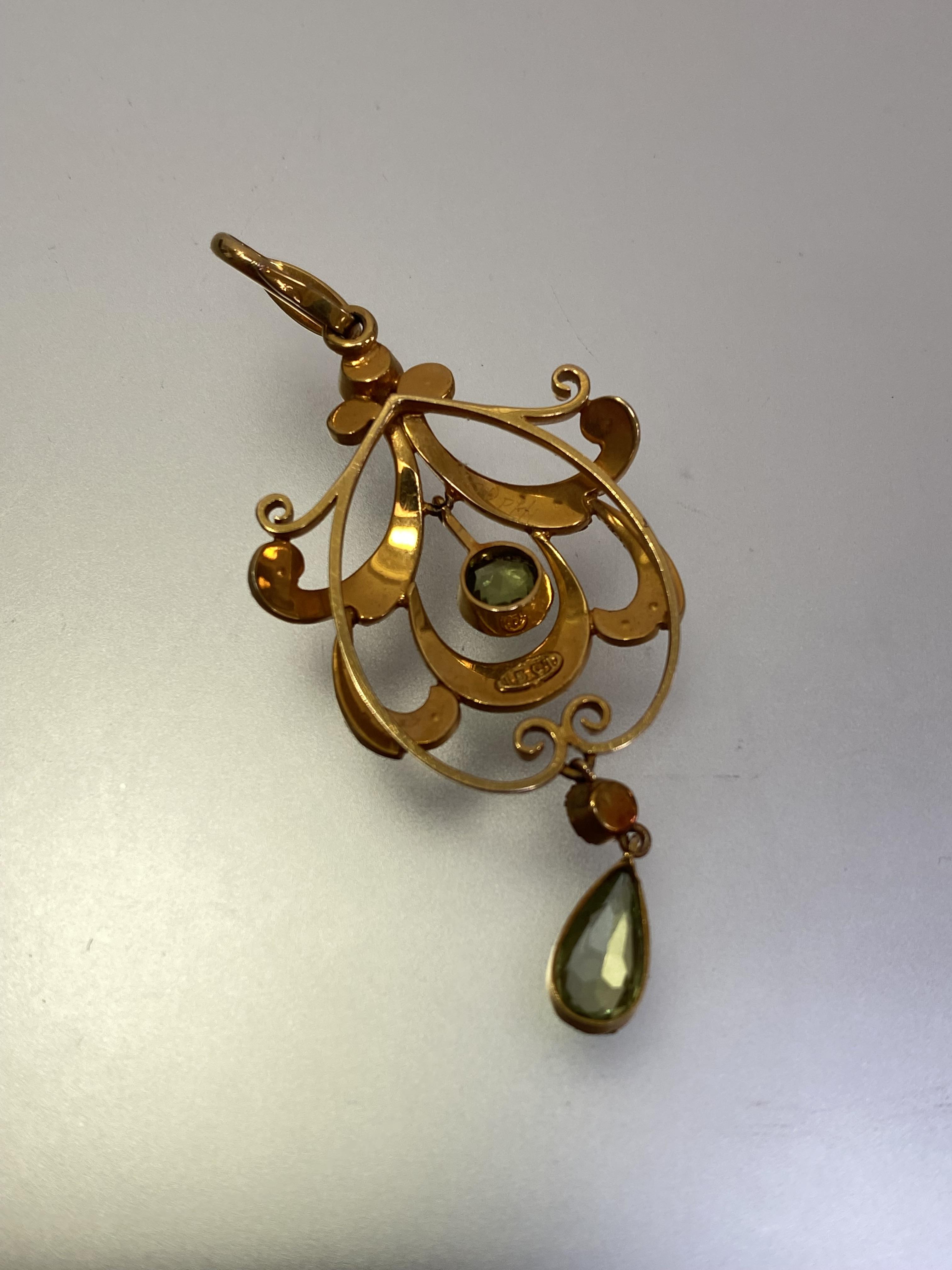 An Edwardian 15ct gold peridot and seed pearl pendant, the pear-cut and round-cut peridots each - Image 2 of 3