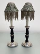 A pair of silver-mounted mahogany candlestick lamps, each with silver stepped circular base and