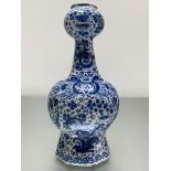 A Dutch Delft blue and white "Garlic" neck bottle vase, late 18th/early 19th century, decorated in