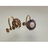A pair of opal and sapphire earrings, the round-cut central opal within a band of claw-set round-cut