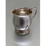 A George V Scottish silver christening mug, Hamilton & Inches, Edinburgh, 1933, of baluster form,