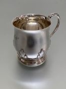 A George V Scottish silver christening mug, Hamilton & Inches, Edinburgh, 1933, of baluster form,