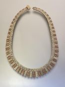 A vintage 9ct bi-colour gold fringe necklace, the yellow and rose gold textured graduated bars