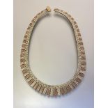 A vintage 9ct bi-colour gold fringe necklace, the yellow and rose gold textured graduated bars