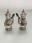A pair of George V silver chocolate pots, George Nathan & Ridley Hayes, Birmingham 1916, of baluster