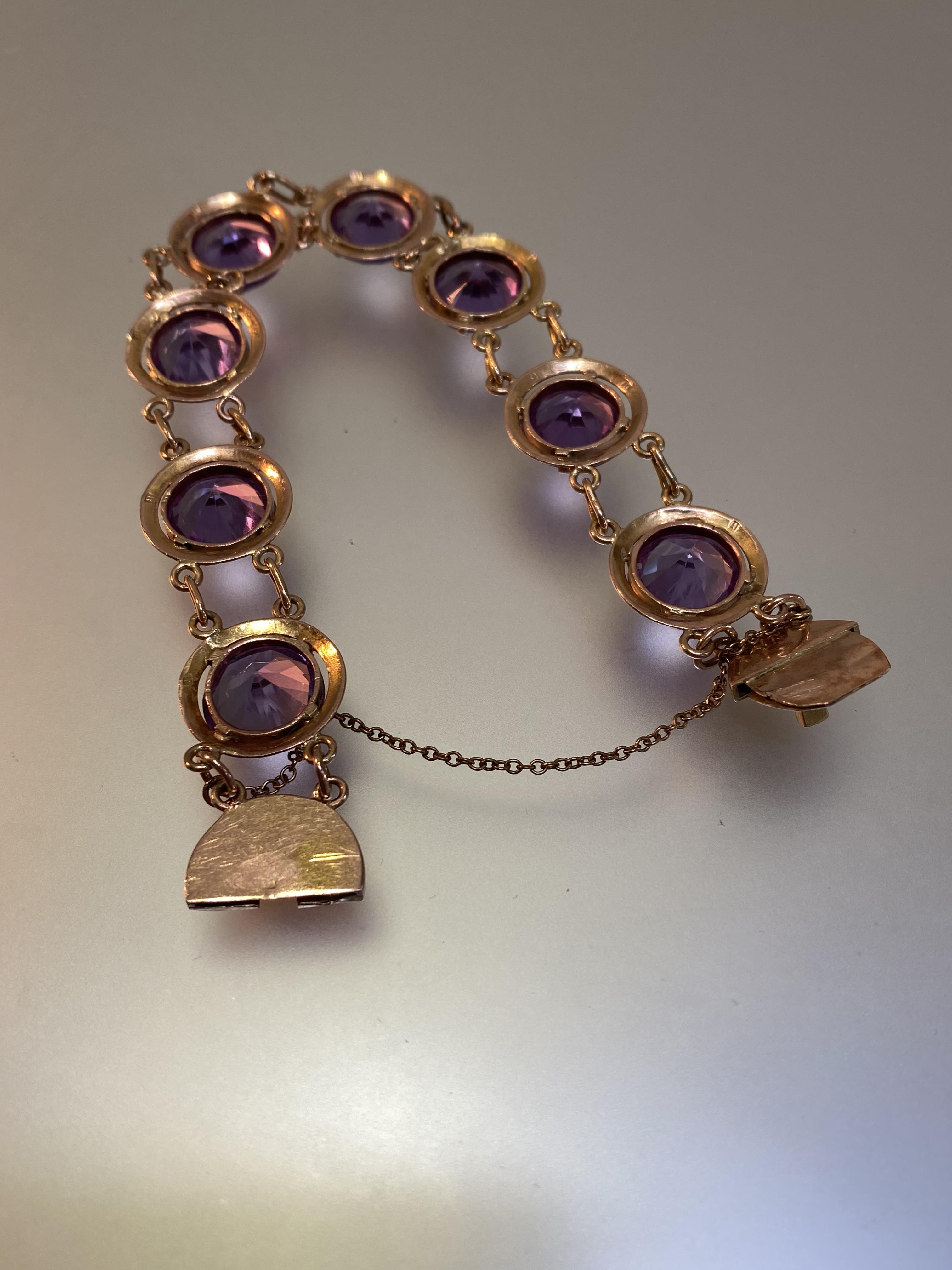 An amethyst bracelet, the eight uniform round-cut stones claw-set in conforming yellow metal discs - Image 4 of 5